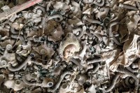 A doll's head in Pripyat's primary school. The gas masks surrounding it are children's: a few days before the accident, there was a nuclear war drill.